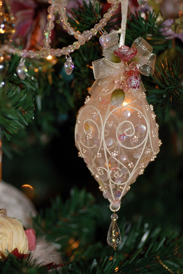 Beautiful and delicate Victorian ornament hanging from a Christmas tree in My Old Kentucky Home